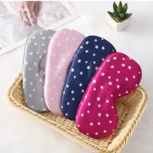 Close-up detail of soft star printed silk sleep masks in multi-colors displayed neatly.