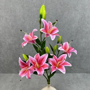 Close-up detail of 6-head artificial pink lily flower arrangement with green leaves in vase.