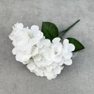 White artificial hydrangea silk flower with green leaves for home wedding decor display.