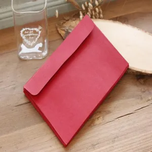 Red paper envelope detail shot, minimalist style card and postcard storage holder for daily use.