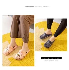 Comfortable couple garden clogs with cute charms and letter prints for summer outdoor activities.