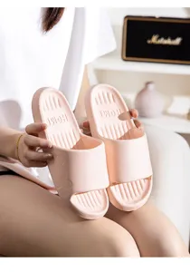 Pink home couple slippers with cute bear pattern, soft foam slide shoes for indoor comfort.
