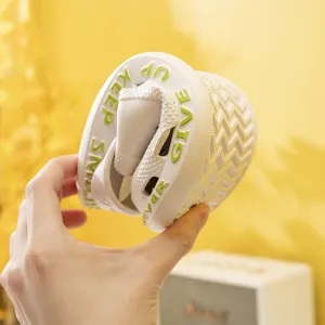 Comfortable white garden shoes for couples, flexible clogs with stylish green letter prints.