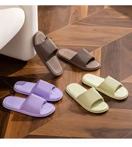 Detail shot of EVA home slippers showcasing non-slip textured sole and cozy indoor lifestyle.