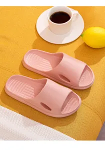 Comfortable pink house slippers for women, anti-slip bathroom slides, soft indoor footwear.