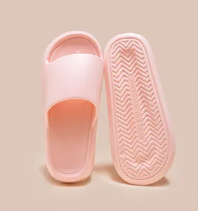 Detail view of pink EVA home slippers showing anti-slip sole texture and clear size imprint.