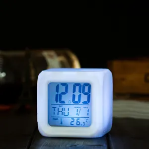 White square LED digital alarm clock with color changing, night light and temperature display.