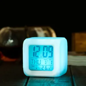 Square LED digital alarm clock with color changing light, temp and date display for home decor.