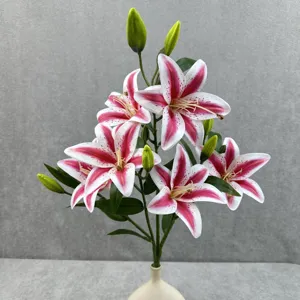 Detail shot of artificial lily flower bouquet with pink white spotted blooms for home decor.