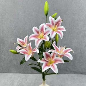 Artificial lily flowers detail shot, pink and white faux floral bouquet for home decor.