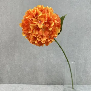 Artificial orange hydrangea flower stem in glass vase for home wedding decoration details