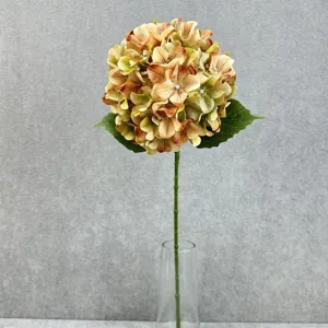 Detailed close-up of a 3d fabric artificial hydrangea flower with realistic gradient petals.