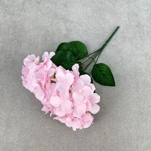 Close up view of pink artificial silk hydrangea flower branch for home decor and wedding floral.