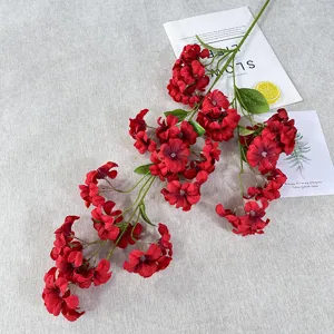 Artificial red flower branch for home decor and photography background props decoration.