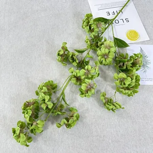 Detailed view of artificial flower branch decoration, ideal for home display and photo props.