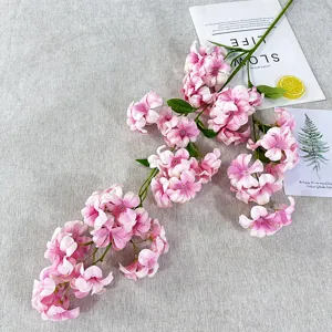 Artificial pink flower branch for home decor, beautiful faux floral arrangement for photo props.