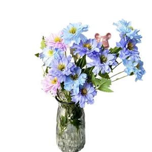 Artificial flower bouquet with glass vase, colorful fake flowers for home and table decor.