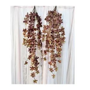 Artificial hanging plant vines for wall decoration, realistic faux greenery leaves for home indoor decor.