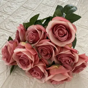 Detailed close-up of artificial rose bouquet, soft fabric pink flowers for home decor.