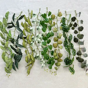 Artificial hanging plant vine for wall decoration, realistic green leaves for indoor ceiling decor.