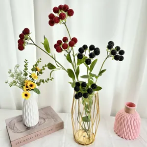 Artificial berry branch flower arrangement with modern vases for home living room decor.