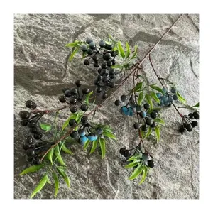 Artificial berry branch with green bamboo leaves for home decor, floral arrangement, and crafts.