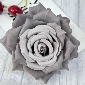 Close-up of a grey artificial velvet rose flower head, perfect for wedding and event decor.