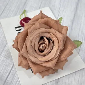 Artificial brown rose flower head for wedding decoration and party floral arrangements.