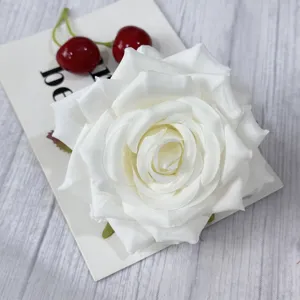 Close-up detail view of the white artificial rose flower head, highlighting exquisite petal layers.