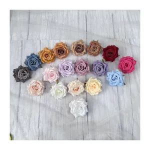 Artificial rose flower heads for wedding decoration and DIY floral arrangement display.