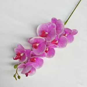 Artificial Phalaenopsis orchid single stem detail showing vibrant purple petals and buds.