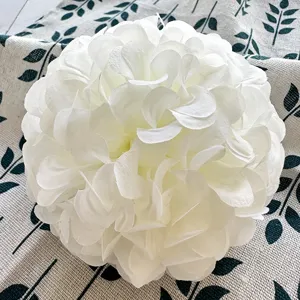 White artificial hibiscus flower ball for wedding table decoration and floral crafts detail.