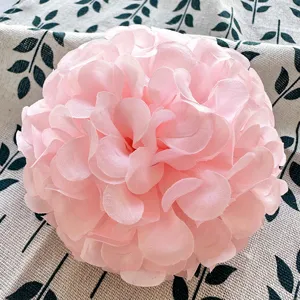 Detailed shot of a pink artificial hibiscus flower ball, perfect for handmade crafts and decor.