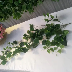 Detail view of artificial green plant vine, perfect for wall decoration and ceiling styling.