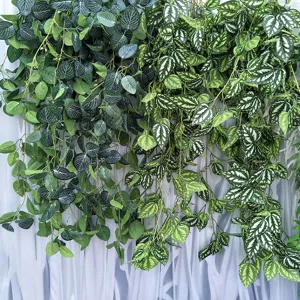Detailed view of artificial hanging vine with white spotted leaves, ideal for wedding decor.