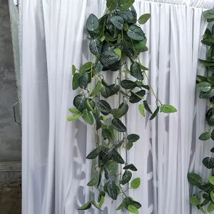 Artificial hanging plant vine with white spotted leaves, perfect for wedding and wall decor detail.