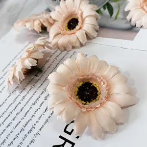 Detailed shot of artificial pink daisy flower heads, perfect for DIY wreaths and photo props.