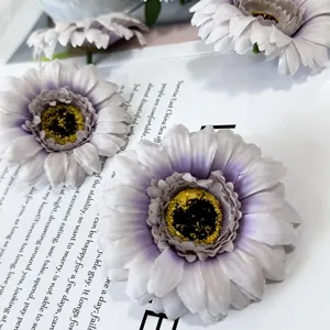 Detailed close-up shot of artificial purple chrysanthemum flowers, ideal for table decor props.