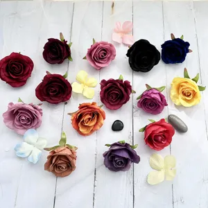 Colorful artificial rose heads silk flowers for DIY wedding party table decor and crafts.