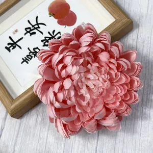 Pink artificial chrysanthemum flower head for home decor, floral arrangements and crafts.