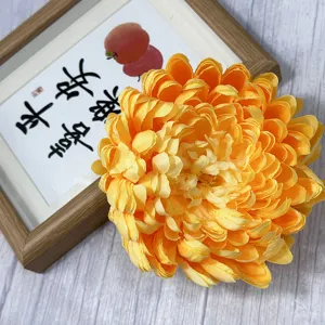 Close-up detail of artificial yellow chrysanthemum flower head for home decor and display.