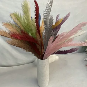 Detail view of colorful artificial cycad leaves bouquet, perfect for modern home indoor decor.