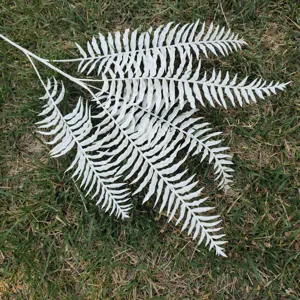 Artificial white fern leaf detail view for home decor and wedding floral arrangement