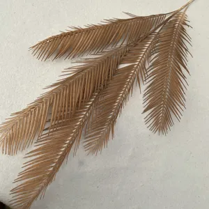 Artificial cycad palm leaf, brown faux plant branch for home indoor floral decoration.