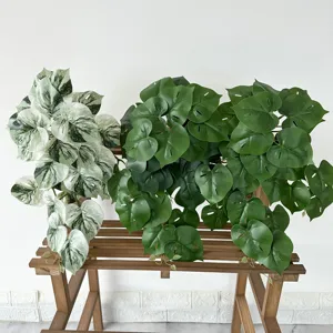 Artificial Monstera plant, fake green leaves for home decor and indoor photography display