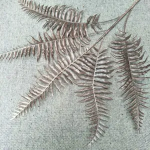 Artificial fern leaf detail closeup for plant wall decoration and home interior design