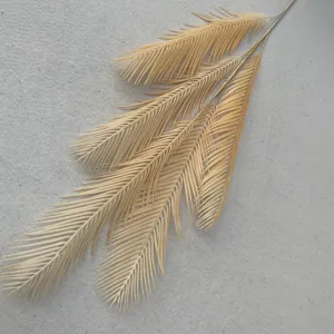 Artificial cycad leaf detail shot, Nordic style home decor plant branch for floral arrangement.