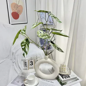 Artificial monstera leaves with ceramic donut vase, modern ins style home decor plant set.