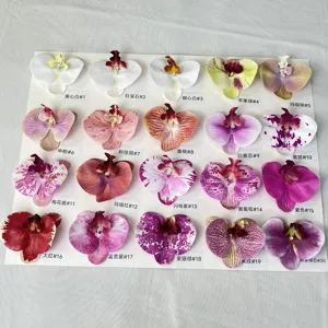 Detailed view of 3D artificial Phalaenopsis orchid flower heads in various color options.