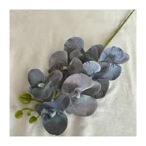 Artificial 7-head phalaenopsis orchid flower stem for indoor home wedding floral decoration.
